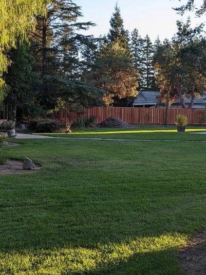 picture of a newly installed long wooden fence